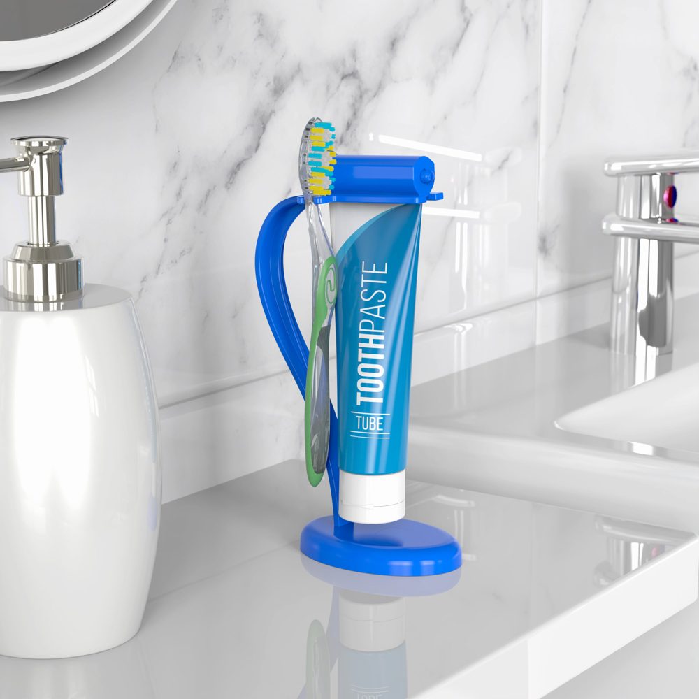 The Squeezer holding a toothpaste tube and toothbrush on a bathroom counter